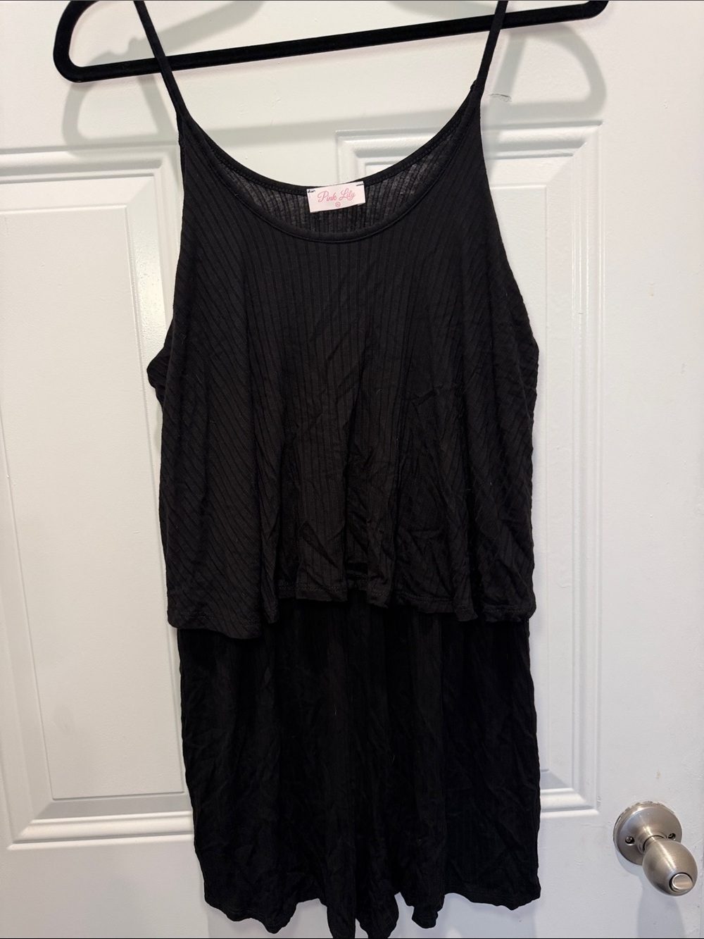 Pink Lily Black Sleeveless romper with Ruffled Overlay